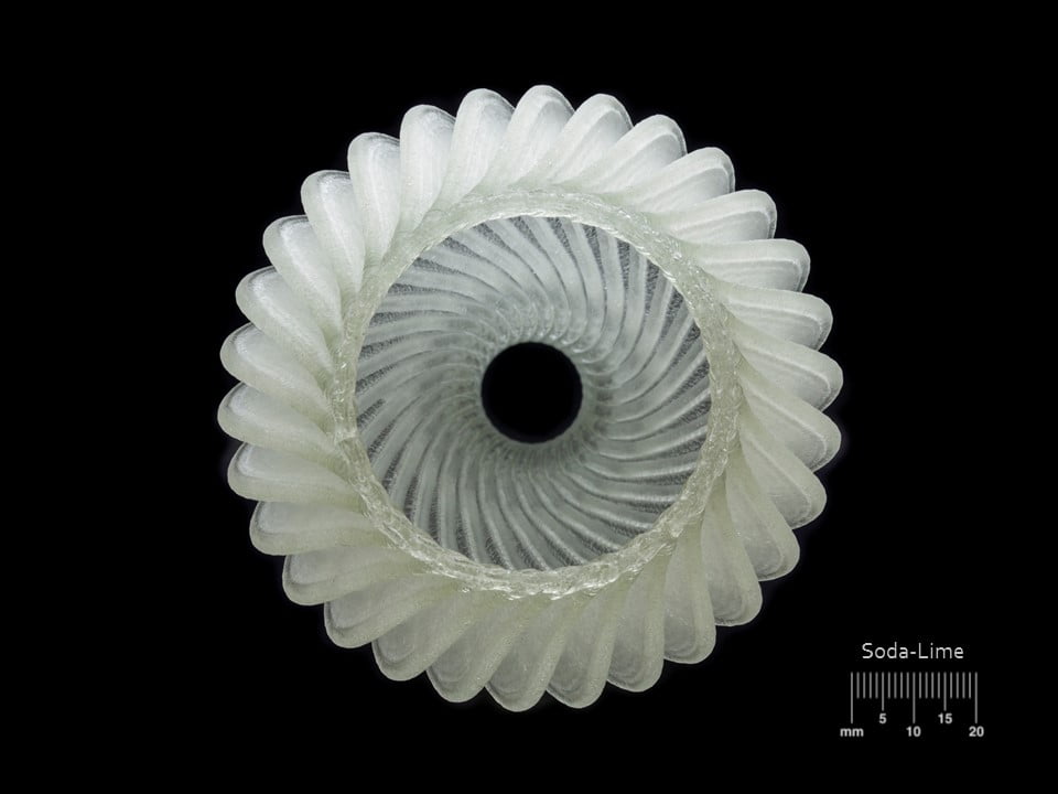 A Micron3DP 3D printed soda-lime glass ornament. Photo via Micron3DP